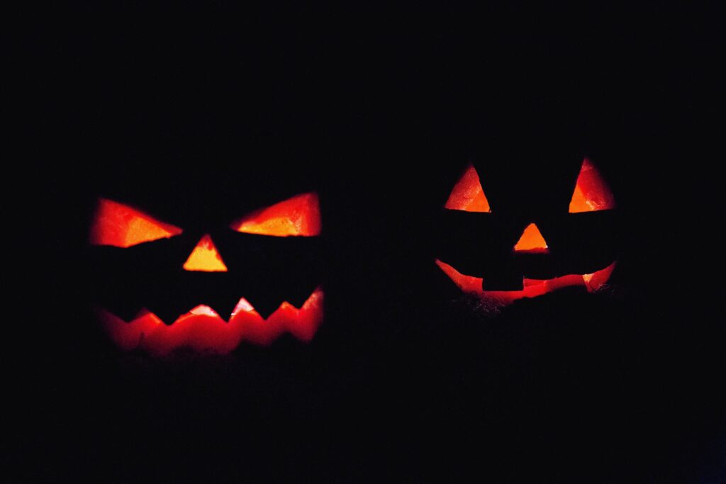 Halloween pumpkins lit by candles