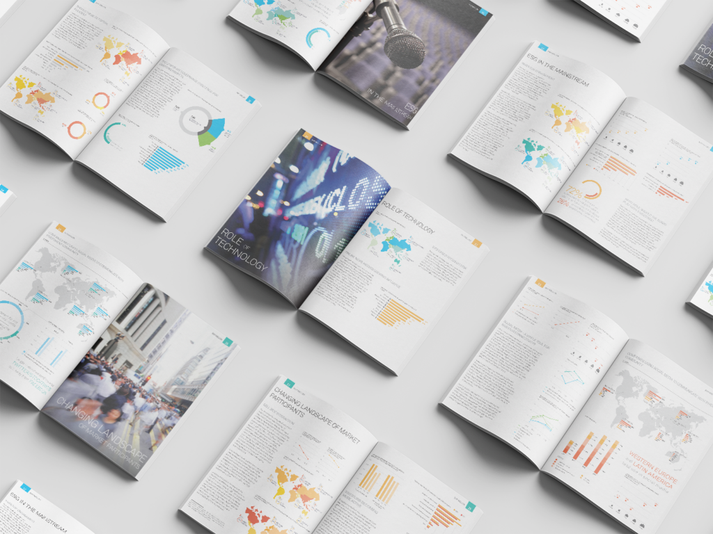 Printed spreads of annual reports depicting financial data visualizations with maps and charts